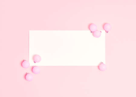 Top view of Christmas composition on pastel pink background. Holiday greeting card with copy space to text.の写真素材