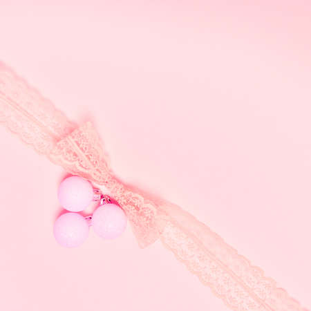 Top view of Christmas composition on pastel pink background. Holiday greeting card with copy space to text.の写真素材