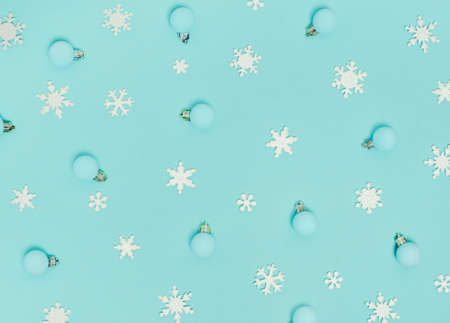 Christmas pattern. New Year decorations on blue background. Snowflakes, Ñhristmas decorations. Flat lay, top view.の写真素材