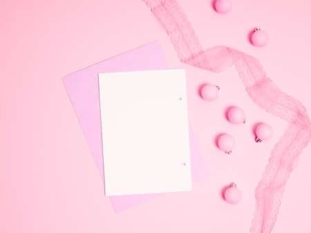 Top view of Christmas composition on pastel pink background. Holiday greeting card with copy space to text.の写真素材