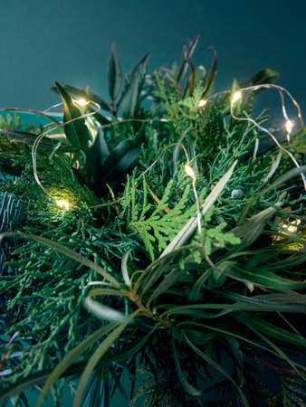 Details of Christmas wreath of fresh spruce, cones and Ñhristmas decorations, close up. New Year decorations.の写真素材