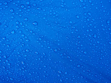 Water drops on waterproof membrane fabric. Morning dew on tent.の写真素材