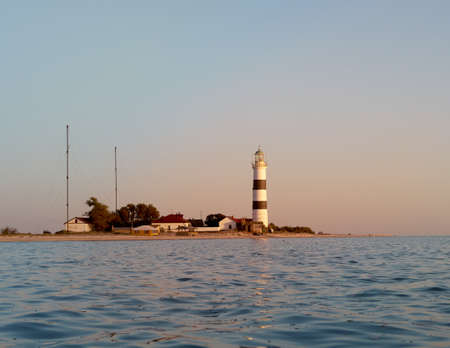 View of a lighthouse. Lighthouse on Tendra Spit, Kherson Oblast, Ukraine. copyspace.の写真素材