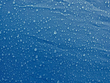 Water drops on waterproof membrane fabric. Morning dew on tent.の写真素材