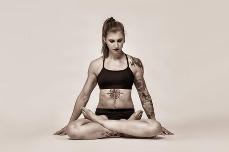 girl athlete performs a complex exercise