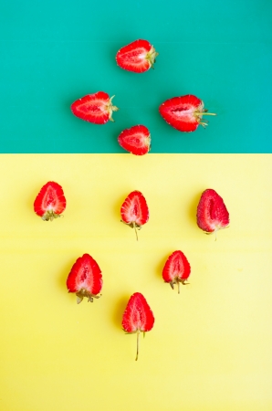 strawberry on the yellow and green paperの写真素材