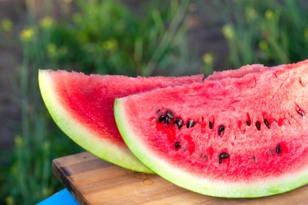 sweet bright rich red watermelon with stonesの写真素材