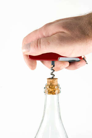 Pocket knife with a corkscrew and a bottle, on white backgroundの写真素材