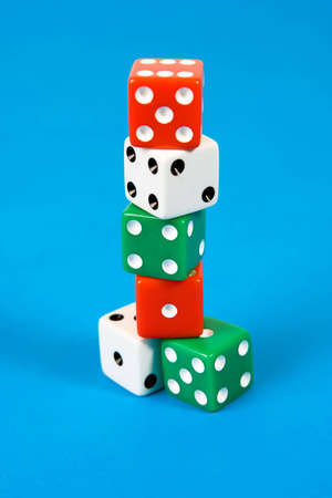 Stack of gaming dice on blue backgroundの写真素材