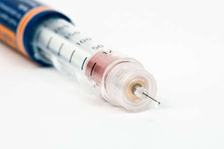 Disposable insulin injection pen on white background
