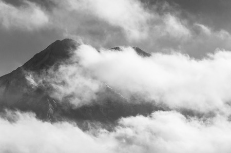 Cloudy peaks in black and whiteの写真素材