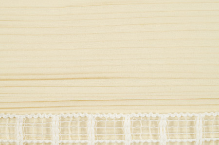 Frame of white ribbon on wooden backgroundの写真素材