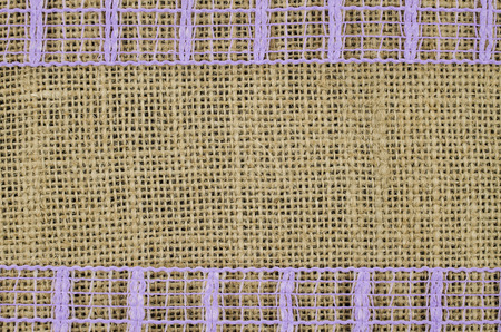 Frame of purple ribbon on linen backgroundの写真素材