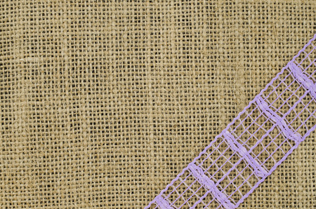 Frame of purple ribbon on linen backgroundの写真素材