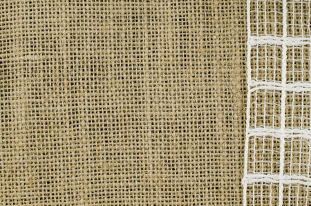 Frame of white ribbon on linen backgroundの写真素材