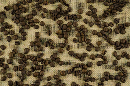 Coffee beans on linen backgroundの写真素材