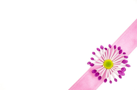 Empty postcard background with pink flower and pink ribbonの写真素材