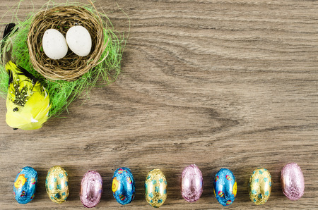 Easter eggs and chicken on wooden backgroundの写真素材