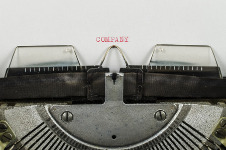 Company word printed on an old typewriterの写真素材