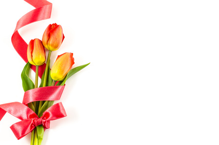 Empty postcard background with colorful flowers and red ribbonの写真素材