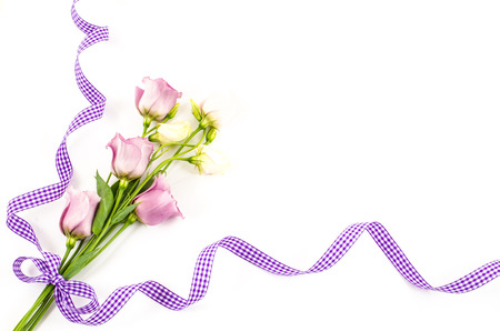 Empty white background with colorful flowers and purple ribbonの写真素材