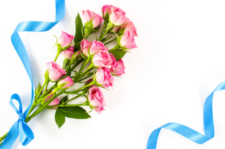 Empty white with colorful flowers and blue ribbonの写真素材
