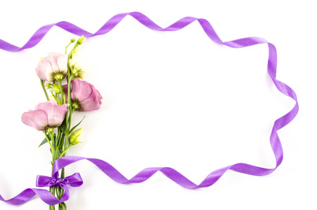 Flower with purple ribbon on white backgroundの写真素材