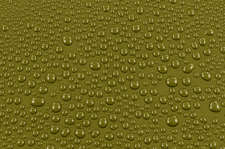 Yellow water drops background or texture. Close-upの写真素材