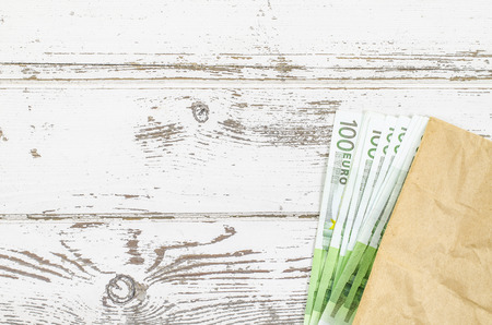 Empty wooden table with money
