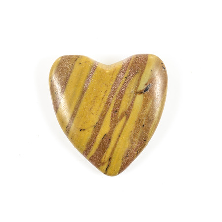 Heart shaped stone on white backgroundの写真素材
