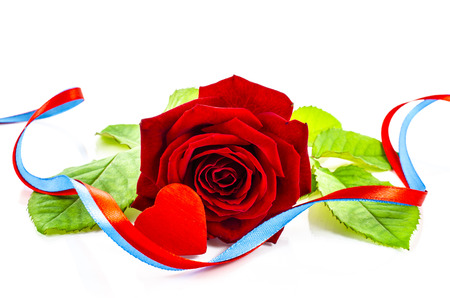 Rose flower with heart and ribbon on a white backgroundの写真素材