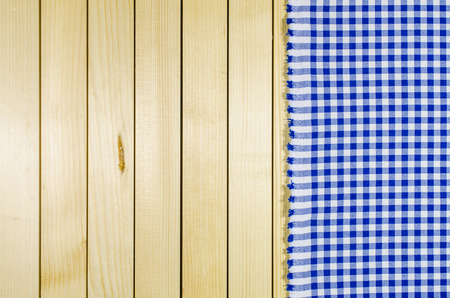 Blue tablecloth over wooden table