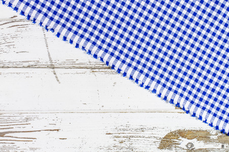 Blue tablecloth over wooden tableの写真素材