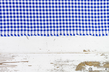 Blue tablecloth over wooden tableの写真素材