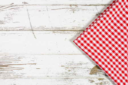 Red tablecloth over wooden table