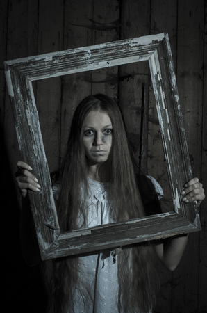 Horror girl in white dressの写真素材