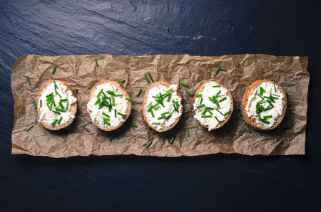 Mini sandwiches on dark background. Top viewの写真素材