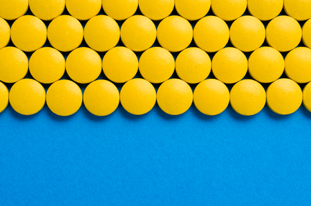 Frame of yellow pillsの写真素材
