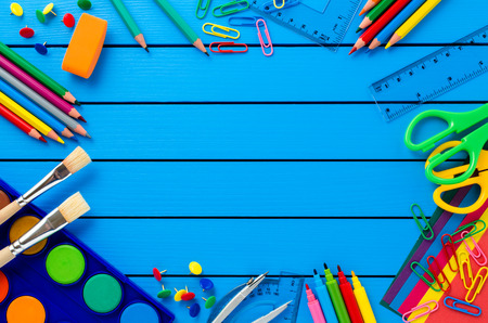 School supplies on blue wooden tableの写真素材