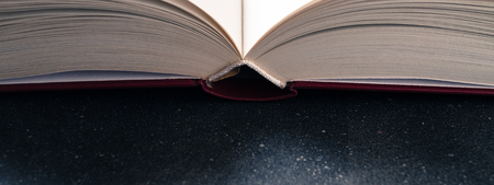 Open book on dark background