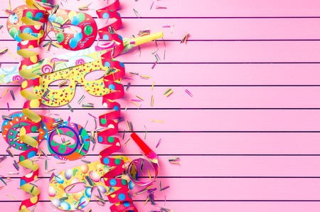 Colorful party decoration on pink backgroundの写真素材