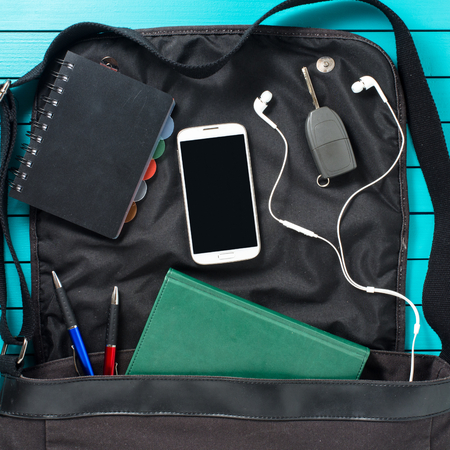 Men bag on wooden tableの写真素材