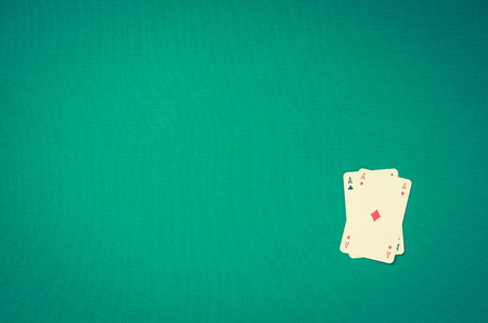 Playing cards on green table