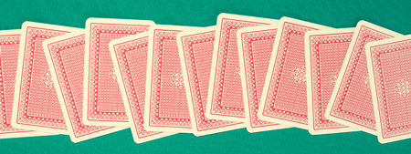 Playing cards on green table
