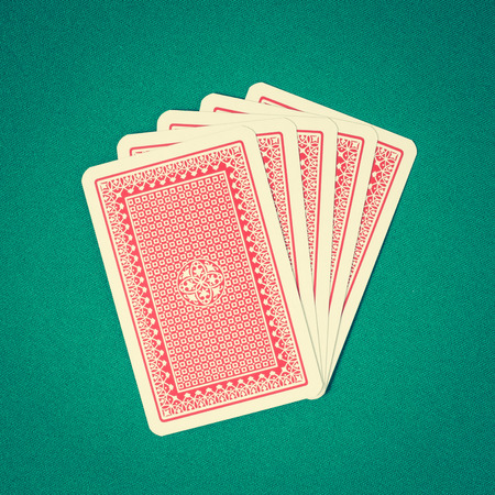 Playing cards on green tableの写真素材
