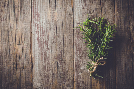 Fresh herbs from garden on an old tableの写真素材