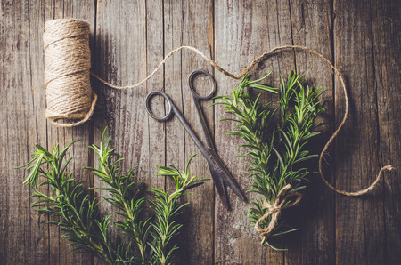 Fresh herbs from garden on an old tableの写真素材