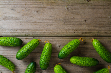 Cucumbers on wooden tableの写真素材