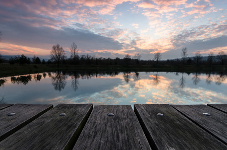 Empty wooden table against blurred background landscapeの写真素材