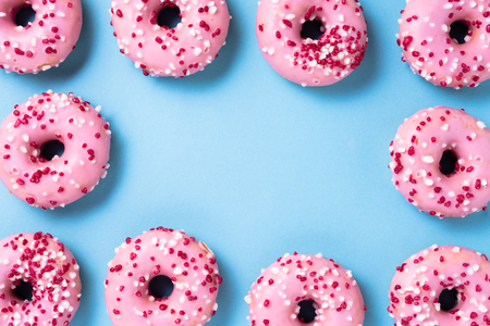 Pink donuts on blue backgroundの写真素材